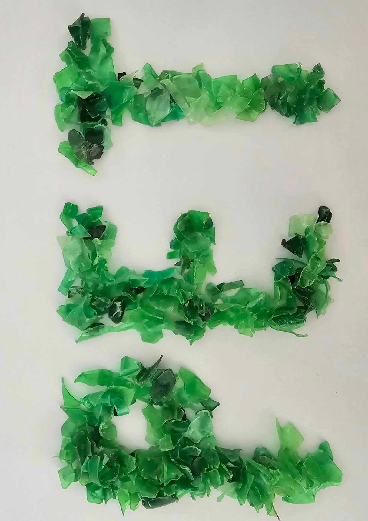 The letter PET made of plastic scraps